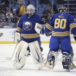 
              Buffalo Sabres goaltender Aaron Dell (80) comes in to replace goaltender Dustin Tokarski (31) during the second period of an NHL hockey game against the Columbus Blue Jackets, Monday, Nov. 22, 2021, in Buffalo, N.Y. (AP Photo/Joshua Bessex)
            