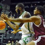 
              Oregon center Franck Kepnang (22) works the ball against Texas Southern forward Brison Gresham (44) during the first half of an NCAA college basketball game Tuesday, Nov. 9, 2021, in Eugene, Ore. (AP Photo/Andy Nelson)
            