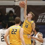 
              Canisius forward Jacco Fritz (10) dunks and his fouled by St. Bonaventure guard Jaren Holmes (5) during the first half of an NCAA college basketball game Sunday, Nov. 14, 2021, in Olean, N.Y. (AP Photo/Joshua Bessex)
            