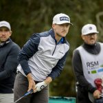
              Mackenzie Hughes, of Canada, center, watches his drive off the second tee during the third round of the RSM Classic golf tournament, Saturday, Nov. 20, 2021, in St. Simons Island, Ga. (AP Photo/Stephen B. Morton)
            