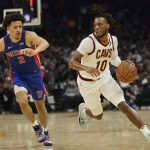 
              Cleveland Cavaliers' Darius Garland (10) drives against Detroit Pistons' Cade Cunningham (2) in the first half of an NBA basketball game, Friday, Nov. 12, 2021, in Cleveland. (AP Photo/Tony Dejak)
            