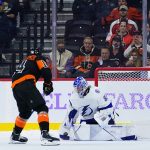 
              Tampa Bay Lightning's Andrei Vasilevskiy, right, blocks a shot by Philadelphia Flyers' Sean Couturier during a shootout in an NHL hockey game, Thursday, Nov. 18, 2021, in Philadelphia. (AP Photo/Matt Slocum)
            