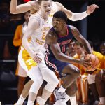 
              Tennessee-Martin guard Koby Jeffries (1) looks for help as he's pressured by Tennessee guard Justin Powell (24) and forward Uros Plavsic (33) during an NCAA college basketball game Tuesday, Nov. 9, 2021, in Knoxville, Tenn. (AP Photo/Wade Payne)
            