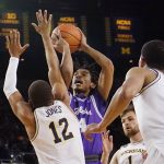 
              Tarleton State guard Tahj Small (4) shoots over the defense of Michigan guard DeVante' Jones (12) during the first half of an NCAA college basketball game, Wednesday, Nov. 24, 2021, in Ann Arbor, Mich. (AP Photo/Carlos Osorio)
            
