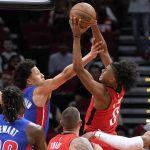 
              Houston Rockets guard Jalen Green, right, drives to the basket as Detroit Pistons guard Cade Cunningham, left rear, defends during the first half of an NBA basketball game Wednesday, Nov. 10, 2021, in Houston. (AP Photo/Eric Christian Smith)
            
