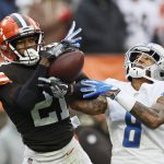 
              Cleveland Browns cornerback Denzel Ward (21) intercepts a pass intended for Detroit Lions wide receiver Josh Reynolds (8) during the second half of an NFL football game, Sunday, Nov. 21, 2021, in Cleveland. (AP Photo/Ron Schwane)
            