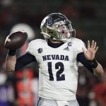 
              Nevada quarterback Carson Strong looks to throw a pass during the first half of the team's NCAA college football game against San Diego State on Saturday, Nov. 13, 2021, in Carson, Calif. (AP Photo/Jae C. Hong)
            