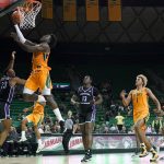 
              Central Arkansas guard Camren Hunter (23) and Eddy Kayouloud (13) defend as Baylor forward Jonathan Tchamwa Tchatchoua, top left, leaps to the basket for as shot in the second half of an NCAA college basketball game in Waco, Texas, Wednesday, Nov. 17, 2021. (AP Photo/Tony Gutierrez)
            