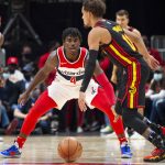 
              Washington Wizards Aaron Holiday (4) defends Atlanta Hawks Trae Young (11) during the second half of an NBA basketball game against the on Monday, Nov. 1, 2021, in Atlanta. (AP Photo/Hakim Wright Sr.)
            