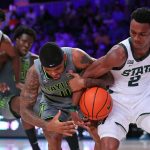 
              In this photo provided by Bahamas Visual Services, Baylor guard James Akinjo (11) and Michigan State guard Tyson Walker (2) battle for the ball  during an NCAA college basketball game at Paradise Island, Bahamas, Friday, Nov. 26, 2021. (Tim Aylen/Bahamas Visual Services via AP)
            