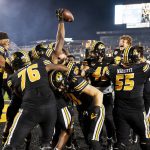 
              The Missouri football team swarms Missouri tight end Daniel Parker Jr. after he scored on a two-point conversion to defeat Florida during overtime of an NCAA college football game Saturday, Nov. 20, 2021, in Columbia, Mo. (AP Photo/L.G. Patterson)
            