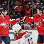 
              Washington Capitals defenseman John Carlson (74) celebrates his goal with center Evgeny Kuznetsov (92) during the first period of an NHL hockey game against the Montreal Canadiens on Wednesday, Nov. 24, 2021, in Washington. Canadiens center Cedric Paquette is at front. (AP Photo/Nick Wass)
            