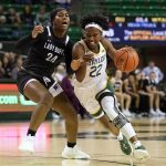 
              West Texas A&M guard Jillian Sowell (24) defends against a drive to the basket by Baylor guard Kamaria McDaniel (22) in the first half of an exhibition NCAA college basketball game in Waco, Texas, Wednesday, Nov. 3, 2021. (AP Photo/Tony Gutierrez)
            