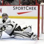 
              Los Angeles Kings goaltender Jonathan Quick (32) watches the puck go wide of the net as he sprawls in the crease during second-period NHL hockey game action against the Ottawa Senators in Ottawa, Ontario, Thursday, Nov. 11, 2021. (Justin Tang/The Canadian Press via AP)
            