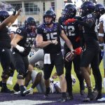 
              TCU quarterback Max Duggan (15) celebrates with teammates after running for a touchdown against Kansas during the second half of an NCAA college football game Saturday, Nov. 20, 2021, in Fort Worth, Texas. TCU won 31-28. (AP Photo/Ron Jenkins)
            