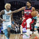 
              Washington Wizards guard Spencer Dinwiddie (26) drives to the basket while guarded by Charlotte Hornets guard Kelly Oubre Jr. (12) during the second half of an NBA basketball game in Charlotte, N.C., Wednesday, Nov. 17, 2021. (AP Photo/Jacob Kupferman)
            
