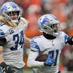 
              Detroit Lions cornerback AJ Parker (41) celebrates an interception during the second half of an NFL football game against the Cleveland Browns, Sunday, Nov. 21, 2021, in Cleveland. Inside linebacker Alex Anzalone (34) looks on. (AP Photo/Ron Schwane)
            