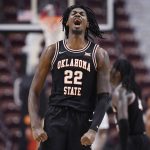 
              Oklahoma State's Kalib Boone (22) reacts in the second half of the team's NCAA college basketball game against North Carolina State, Wednesday, Nov. 17, 2021, in Uncasville, Conn. (AP Photo/Jessica Hill)
            