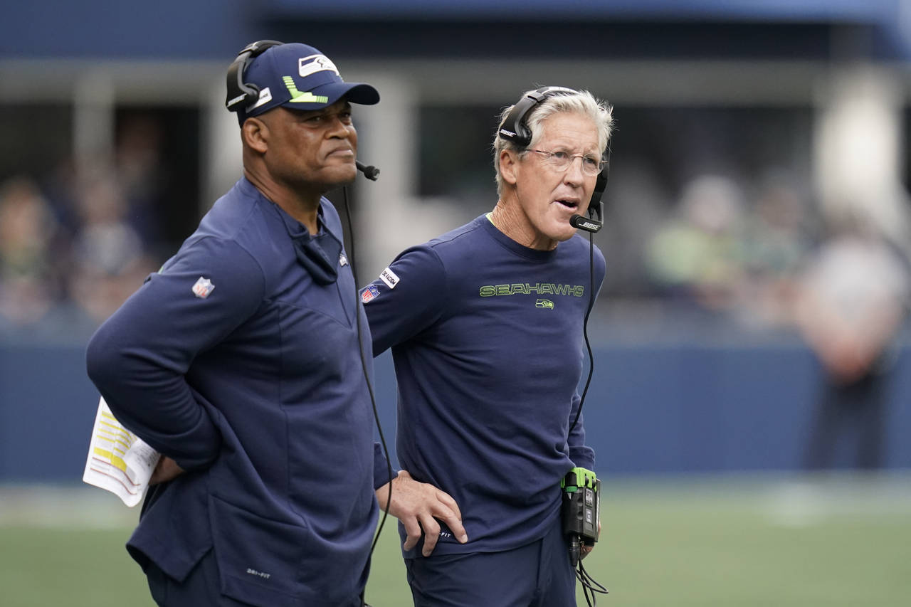 FILE - Seattle Seahawks head coach Pete Carroll, right, stands with defensive coordinator Ken Norto...