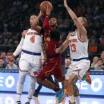 
              Cleveland Cavaliers guard Darius Garland (10) drives to the basket against New York Knicks guards Derrick Rose (4) and Evan Fournier (13) during the first half of an NBA basketball game in New York, Sunday, Nov. 7, 2021. (AP Photo/Noah K. Murray)
            