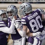 
              Kansas State defensive back Marvin Martin, center, celebrates with teammates after after he recovered a punt blocked by wide receiver Ty Bowman (80) and ran for a touchdown during the first half of an NCAA college football game against West Virginia, Saturday, Nov. 13, 2021, in Manhattan, Kan. (AP Photo/Charlie Riedel)
            
