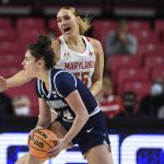 
              Maryland's Chloe Bibby defends as Villanova's Brianna Herlihy looks to pass during the first half of an NCAA college basketball game on Friday, Nov. 12, 2021, in College Park, Md. Maryland won 88-67.(AP Photo/Gail Burton)
            
