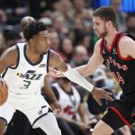 
              Utah Jazz guard Trent Forrest (3) is defended by Toronto Raptors guard Svi Mykhailiuk (14) during the first half of an NBA basketball game Monday, Nov. 18, 2021, in Salt Lake City. (AP Photo/George Frey)
            