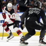 
              New Jersey Devils center Yegor Sharangovich (17) looks for room around Tampa Bay Lightning defenseman Ryan McDonagh (27) during the first period of an NHL hockey game Saturday, Nov. 20, 2021, in Tampa, Fla. (AP Photo/Chris O'Meara)
            