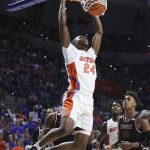 
              Florida guard Phlandrous Fleming Jr. (24) dunks against Troy during the first half of an NCAA college basketball game Sunday, Nov. 28, 2021, in Gainesville, Fla. (AP Photo/Matt Stamey)
            