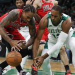 
              Chicago Bulls' DeMar DeRozan (11) battles Boston Celtics' Al Horford (42) for a loose ball during the first half of an NBA basketball game, Monday, Nov. 1, 2021, in Boston. (AP Photo/Michael Dwyer)
            