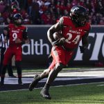 
              Cincinnati running back Jerome Ford (24) runs with the ball during the first half of an NCAA college football game against Tulsa Saturday, Nov. 6, 2021, in Cincinnati. (AP Photo/Jeff Dean)
            