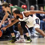 
              Connecticut's R.J. Cole (2) attempts a steal against Binghamton's Hakon Hjalmarsson (1) during the first half of an NCAA college basketball game Saturday, Nov. 20, 2021, in Hartford, Conn. (AP Photo/Stephen Dunn)
            