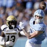 
              North Carolina wide receiver Justin Olson (83) and Wofford defensive back Amir Annoor (13) chase a pass intended for Olson during the first half of an NCAA college football game in Chapel Hill, N.C., Saturday, Nov. 20, 2021. (AP Photo/Gerry Broome)
            