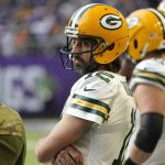 
              Green Bay Packers quarterback Aaron Rodgers (12) stands on the sideline during the second half of an NFL football game against the Minnesota Vikings, Sunday, Nov. 21, 2021, in Minneapolis. (AP Photo/Jim Mone)
            
