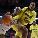 
              Maryland's Angel Reese, left and UNC Wilmington's Dazia Powell struggle for the ball during the first half of an NCAA college basketball game on Thursday, Nov. 18, 2021, in College Park, Md. (AP Photo/Gail Burton)
            