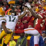 
              Kansas City Chiefs cornerback L'Jarius Sneed, right, intercepts a pass intended for Green Bay Packers wide receiver Davante Adams (17) as Packers wide receiver Marquez Valdes-Scantling (83) watches during the second half of an NFL football game Sunday, Nov. 7, 2021, in Kansas City, Mo. (AP Photo/Ed Zurga)
            