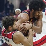 
              Cleveland Cavaliers' Jarrett Allen, top, and Washington Wizards' Raul Neto battle for a jump ball in the first half of an NBA basketball game, Wednesday, Nov. 10, 2021, in Cleveland. (AP Photo/Tony Dejak)
            