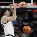 
              Gonzaga center Chet Holmgren dunks during the first half of the team's NCAA college basketball game against Bellarmine, Friday, Nov. 19, 2021, in Spokane, Wash. (AP Photo/Young Kwak)
            