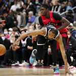 
              Toronto Raptors forward Pascal Siakam, top, picks up a foul on Brooklyn Nets forward Kevin Durant as they fight for the ball during second-half NBA basketball game action in Toronto, Sunday, Nov. 7, 2021. (Frank Gunn/The Canadian Press via AP)
            