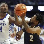 
              Mount St. Mary's Deandre Thomas (2) shoots while pressured by Kentucky's Oscar Tshiebwe (34) during the second half of an NCAA college basketball game in Lexington, Ky., Tuesday, Nov. 16, 2021. Kentucky won 80-55. (AP Photo/James Crisp)
            