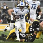 
              Detroit Lions running back Godwin Igwebuike (35) runs 42-yards for a touchdown during the second half of an NFL football game against the Pittsburgh Steelers in Pittsburgh, Sunday, Nov. 14, 2021. (AP Photo/Don Wright)
            