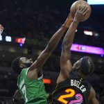 
              Boston Celtics guard Jaylen Brown (7) blocks a shot to the basket by Miami Heat forward Jimmy Butler (22) during the first half of an NBA basketball game, Thursday, Nov. 4, 2021, in Miami. (AP Photo/Marta Lavandier)
            