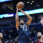 
              Minnesota Timberwolves center Karl-Anthony Towns (32) shoots over New Orleans Pelicans center Jonas Valanciunas, right, in the first half of an NBA basketball game in New Orleans, Monday, Nov. 22, 2021. (AP Photo/Gerald Herbert)
            
