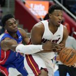 
              Detroit Pistons guard Hamidou Diallo (6) reaches in on Miami Heat guard Kyle Lowry (7) during the second half of an NBA basketball game, Tuesday, Nov. 23, 2021, in Detroit. (AP Photo/Carlos Osorio)
            