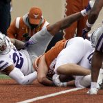 
              Texas tight end Cade Brewer, right, catches a touchdown pass as Kansas State defensive back Julius Brents (23) defends during the first half of an NCAA college football game in Austin, Texas, Friday, Nov. 26, 2021. (AP Photo/Chuck Burton)
            