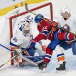 
              Montreal Canadiens' Artturi Lehkonen (62) is sandwiched between New York Islanders goaltender Ilya Sorokin (30) and Islanders' Scott Mayfield (24) during the third period of an NHL hockey game Thursday, Nov. 4, 2021, in Montreal. (Ryan Remiorz/The Canadian Press via AP)
            