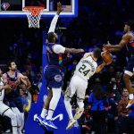 
              Milwaukee Bucks' Pat Connaughton (24) cannot get a shot past Philadelphia 76ers' Tyrese Maxey (0) and Andre Drummond (1) during the second half of an NBA basketball game, Tuesday, Nov. 9, 2021, in Philadelphia. (AP Photo/Matt Slocum)
            