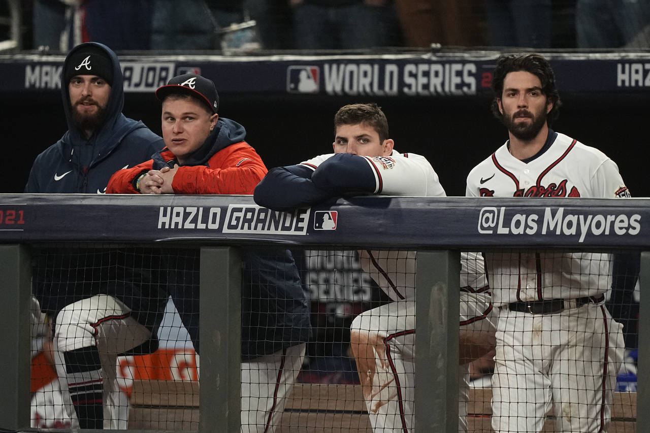Members of the Atlanta Braves watch during the ninth inning in Game 5 of baseball's World Series be...