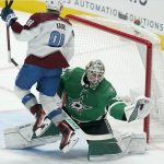 
              Dallas Stars goaltender Jake Oettinger (29) makes a save with his glove in front of Colorado Avalanche center Nazem Kadri (91) during the third period of an NHL hockey game in Dallas, Friday, Nov. 26, 2021. The Stars won 3-1. (AP Photo/LM Otero)
            