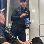
              Seven-time NASCAR champion Jimmie Johnson stands in the doorway of the team hauler at Road Atlanta Raceway in Braselton, Georgia, Friday, Nov. 12, 2021, talking with Gary Nelson, team manager of the IMSA sports car Action Express Racing team. Johnson has been reunited with former NASCAR crew chief Chad Knaus four times this season as Knaus has run a sports car team that Johnson and Hendrick Motorsports put together in partnership with Action Express. (AP Photo/Jenna Fryer)
            